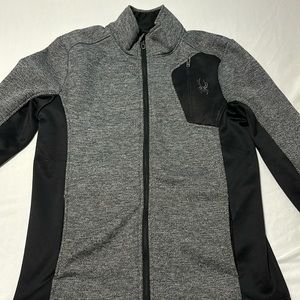Grey and black full zip performance Spyder jacket.